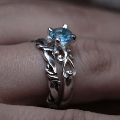 FRIGG – PAR DE ALIANÇAS (SOLITÁRIO + ANEL NORDIC ROPE) EM PRATA 925 COM ZIRCÔNIA AZUL CLARO